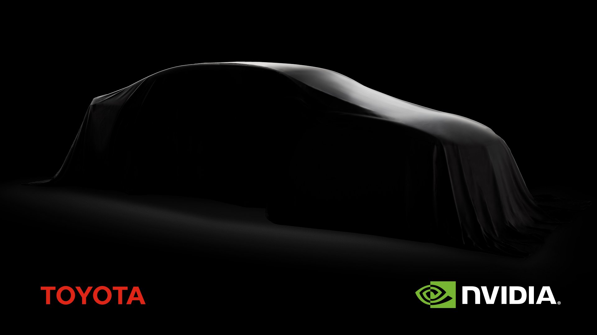 Silhouette of a car covered in a blanket against dark background with Toyota and NVIDIA logos at bottom corners.