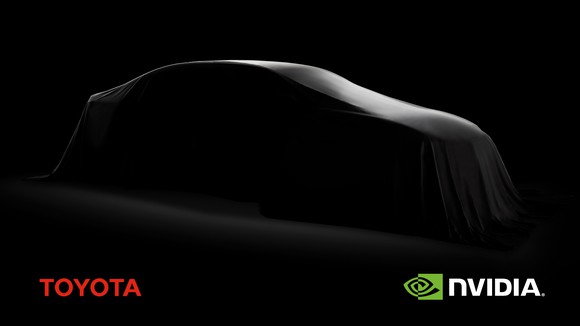 Silhouette of a car covered in a blanket against dark background with Toyota and NVIDIA logos at bottom corners.