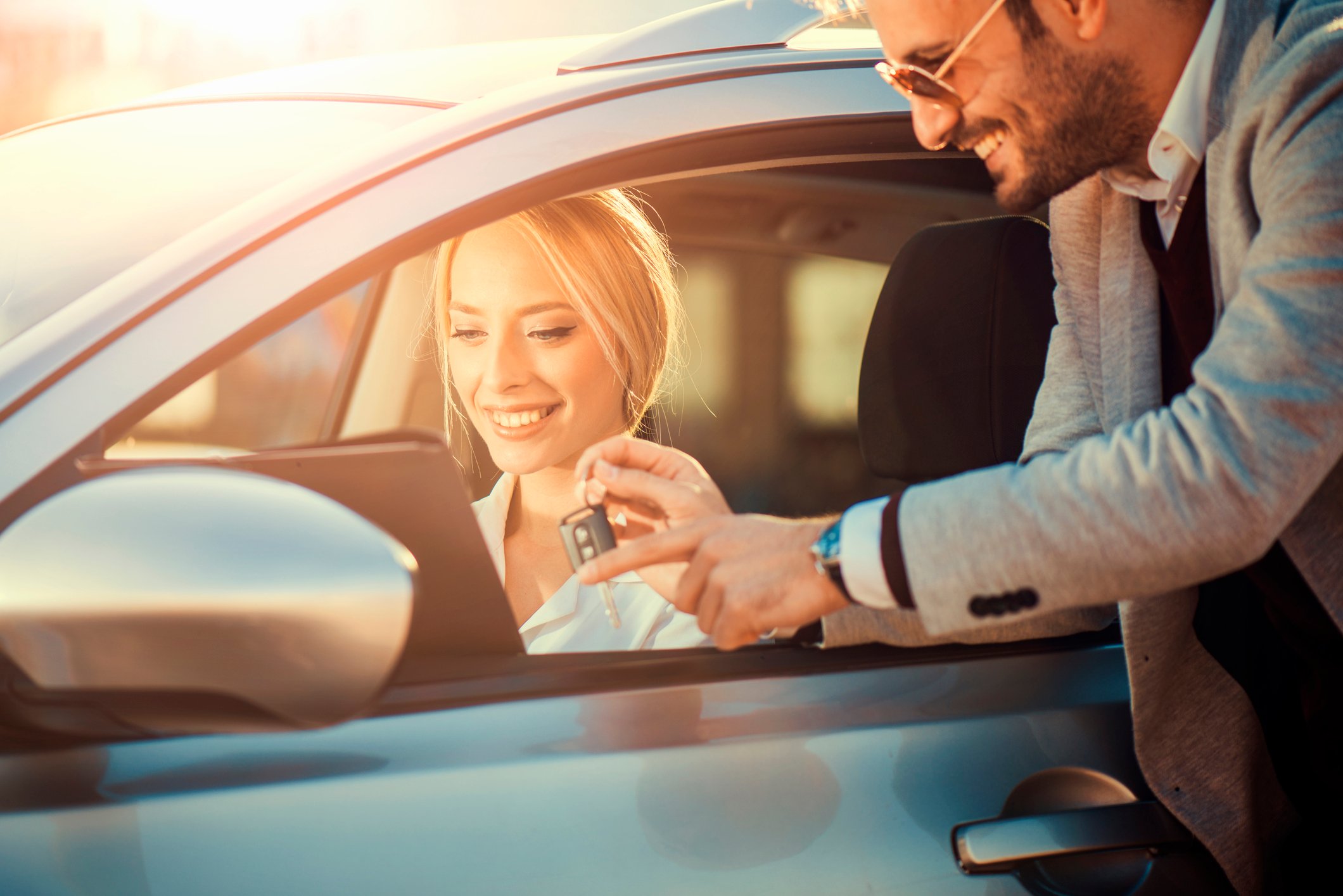 Young woman buying a car.