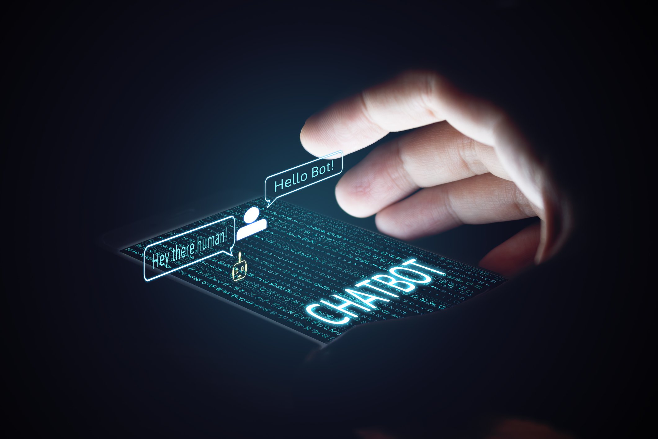 Fingers hover over touch screen displaying "Hey there human!" and response "Hello bot!" 