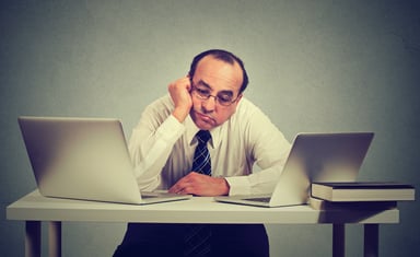 older man bored on the job_GettyImages-668330010