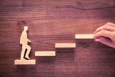 human outline walking up the corporate ladder