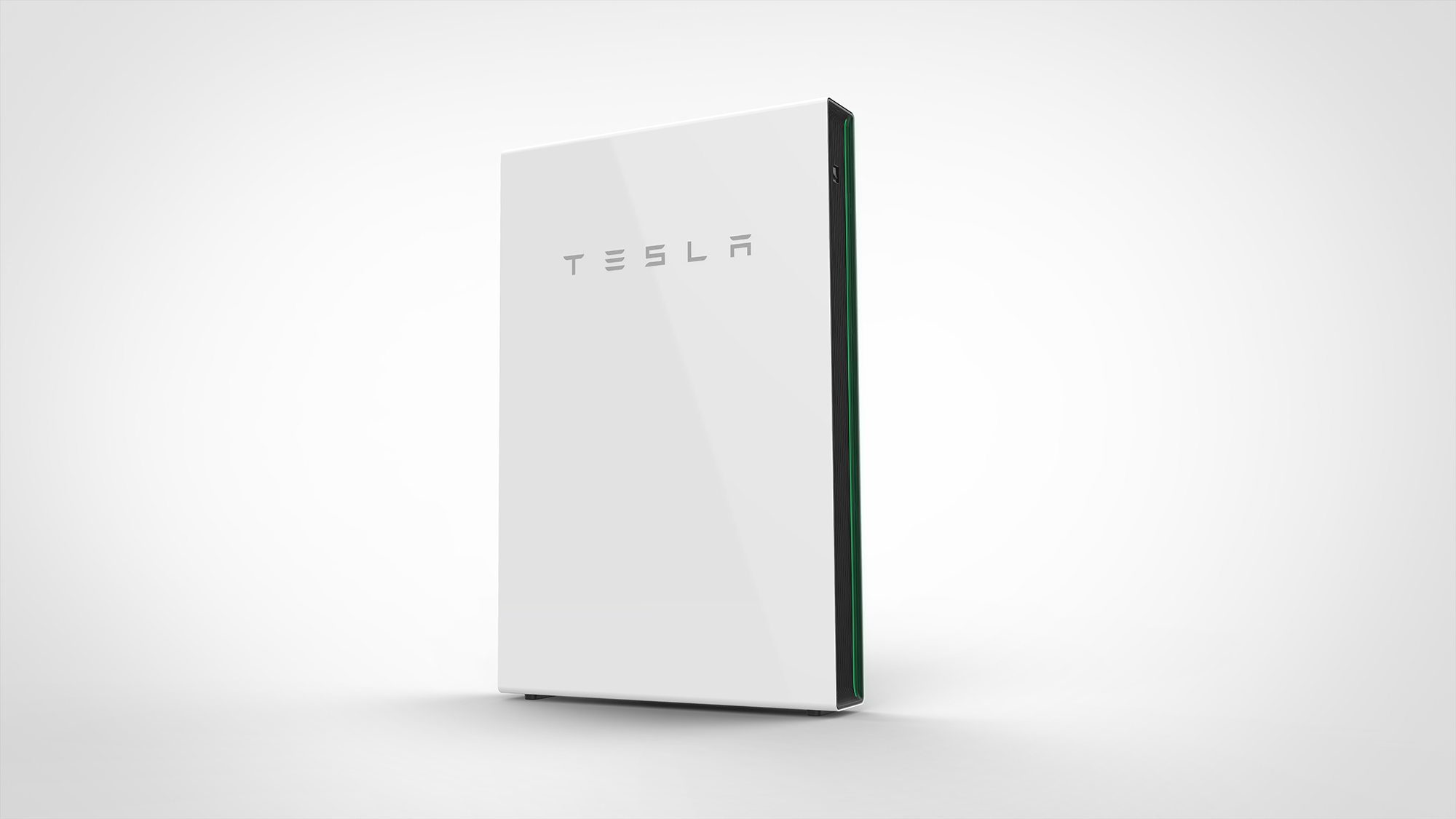 Tesla Powerwall battery pack on a white wall.