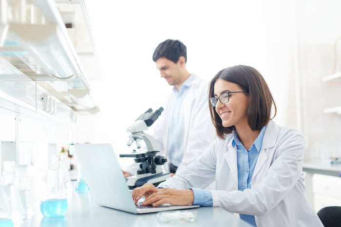 Two scientists working in their lab.