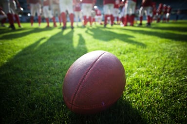 Football with players in background