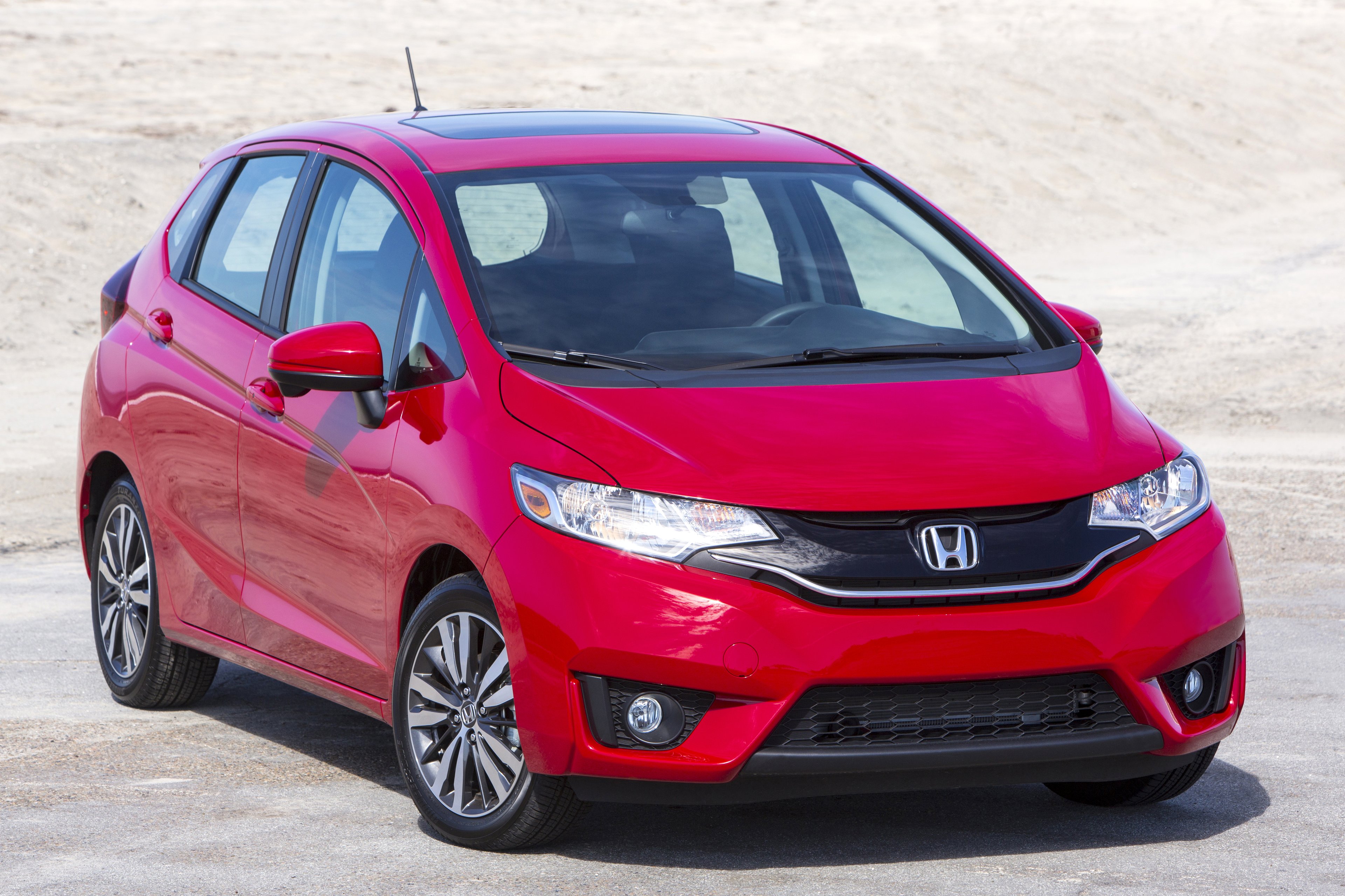 A red Honda Fit.