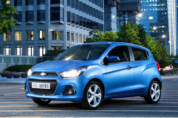 A blue Chevy Spark hatchback.