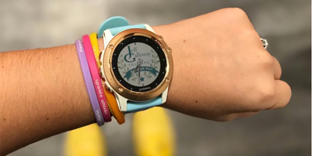 A wrist sporting a Garmin fitness tracker.