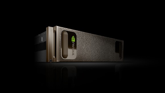 Dark grey aluminum chassis on its side against black ground with NVIDIA logo stamped on its side.