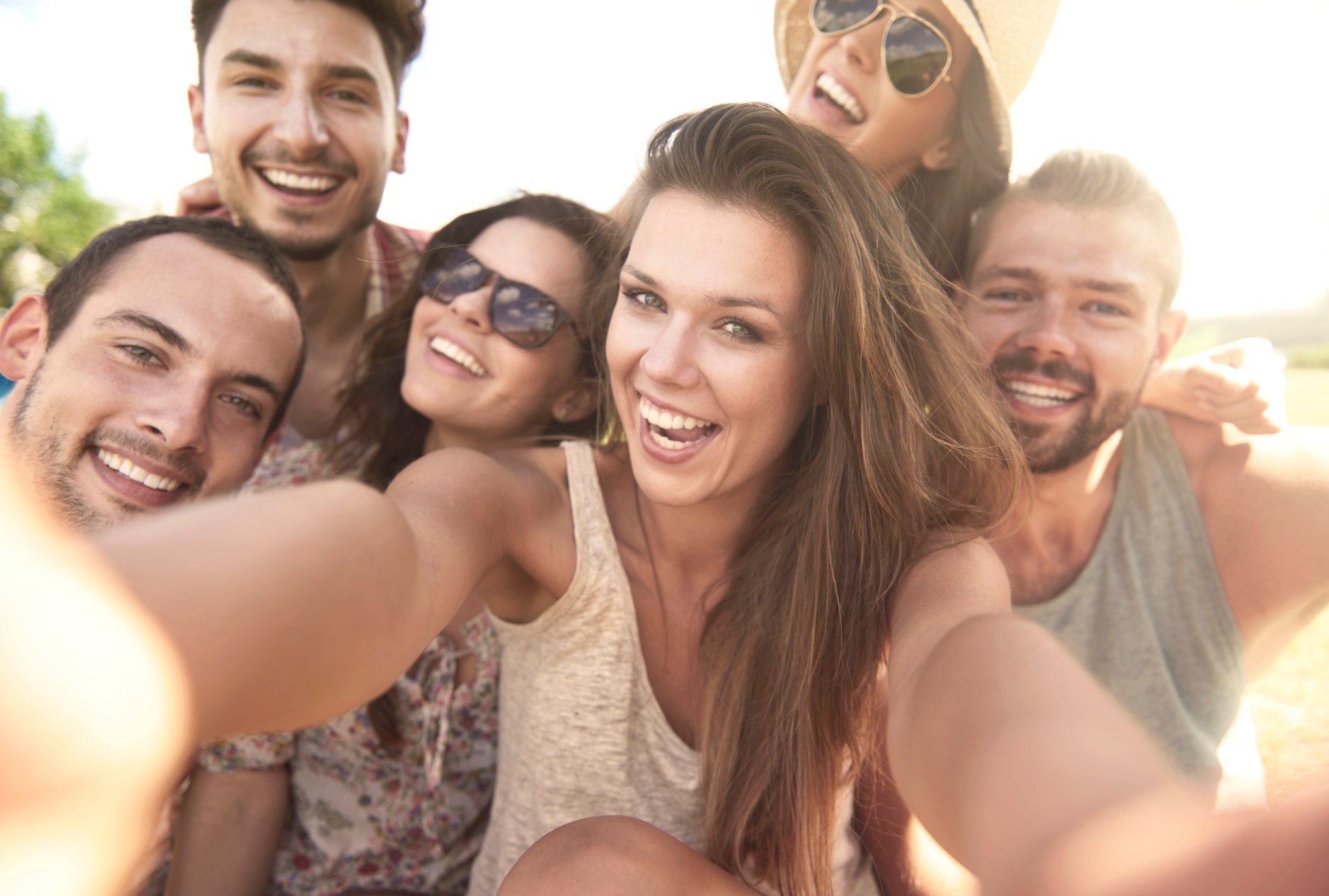 Group of people taking a selfie.