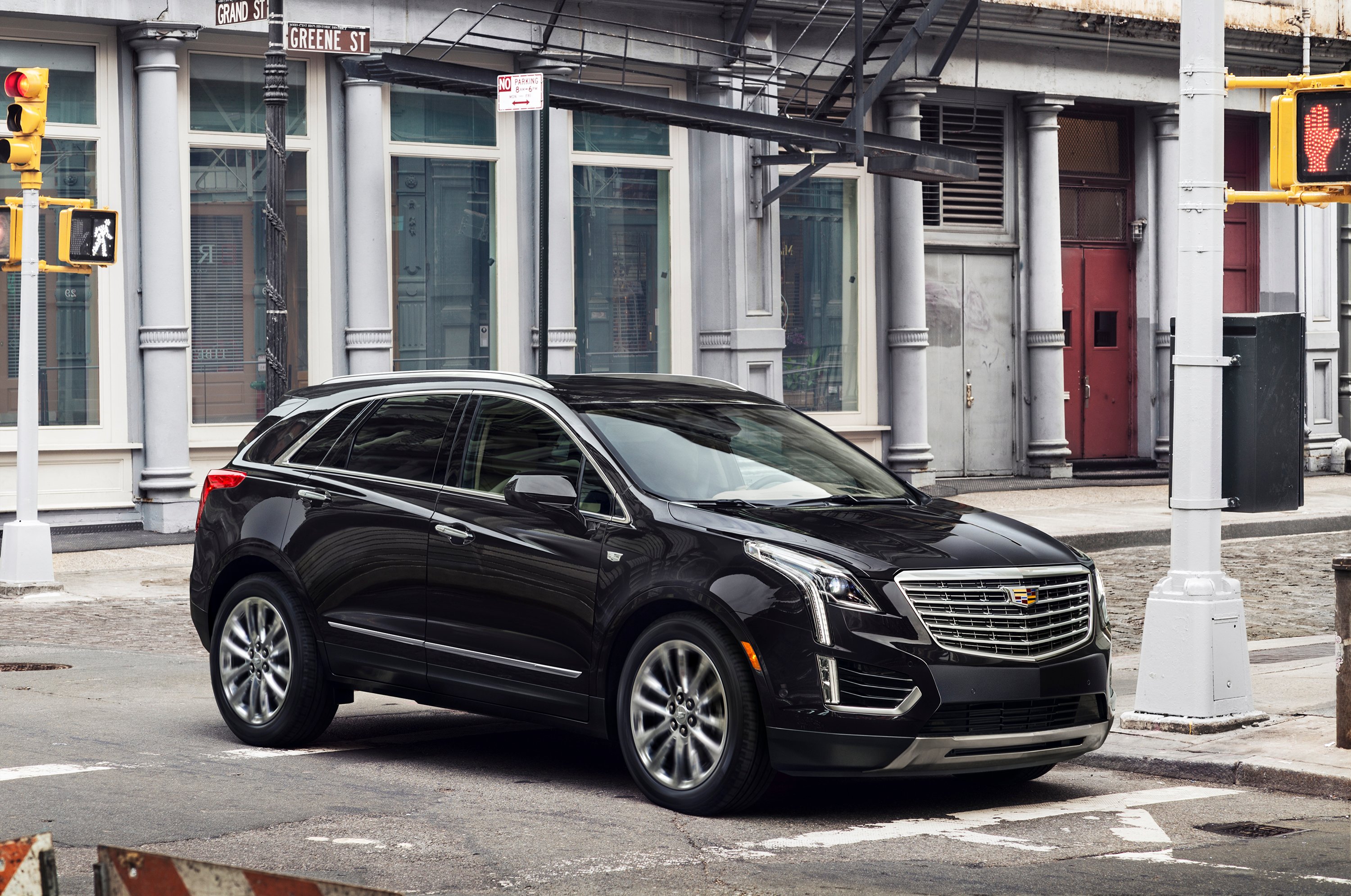 A black Cadillac XT5 crossover SUV on a New York City street.