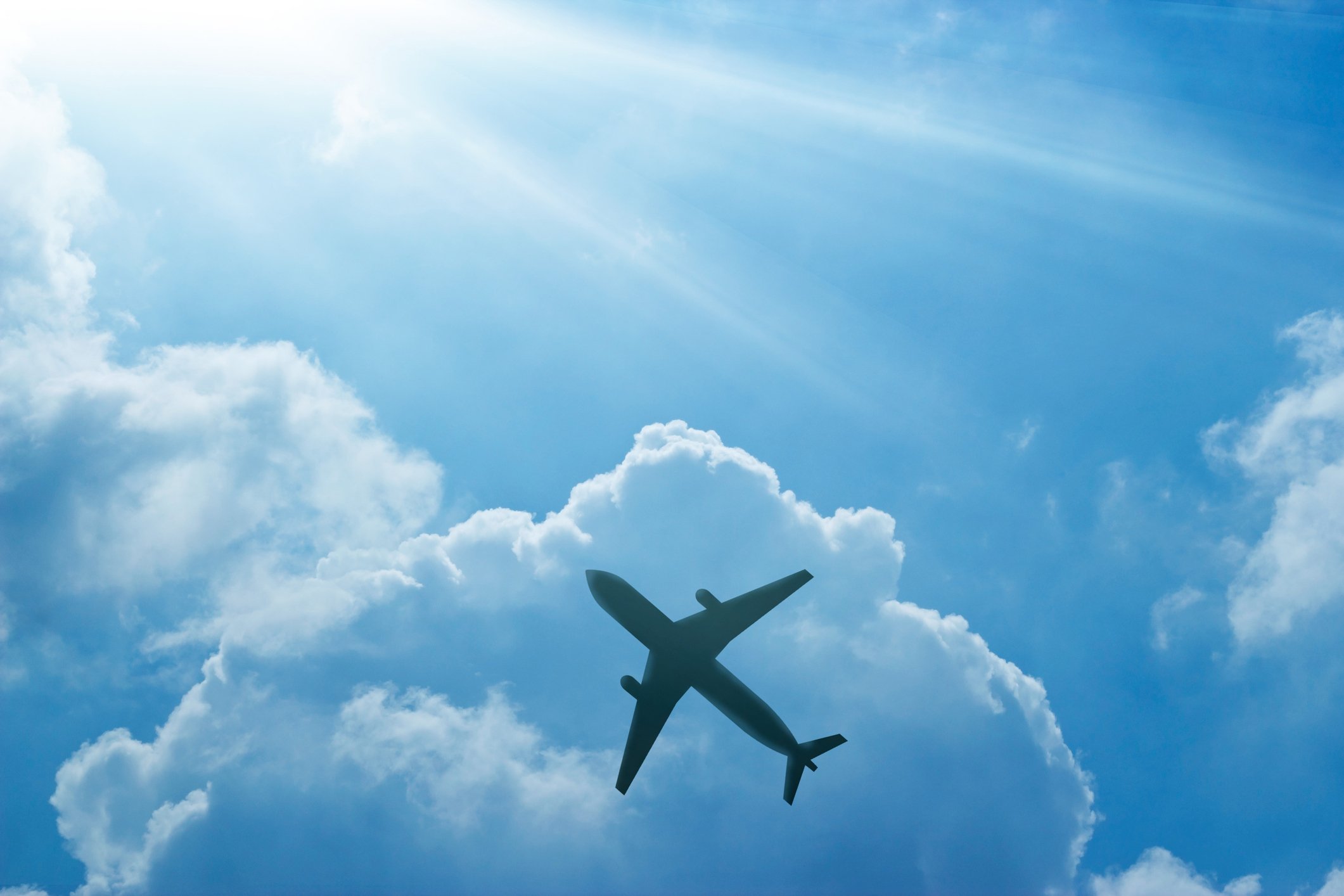 Airplane against blue sky