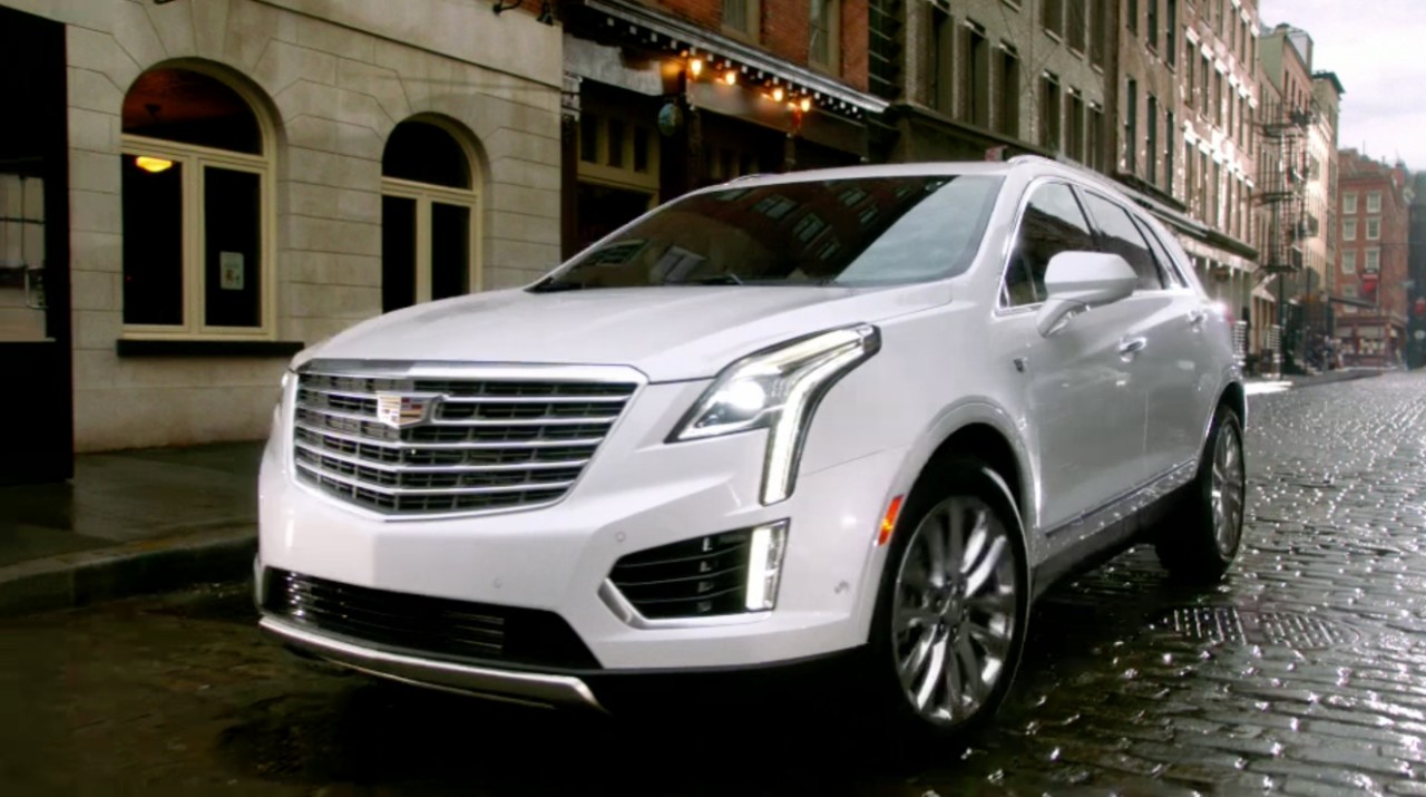 A Cadillac SUV on the street