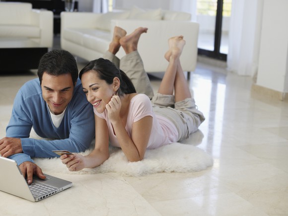 Man and woman shopping online