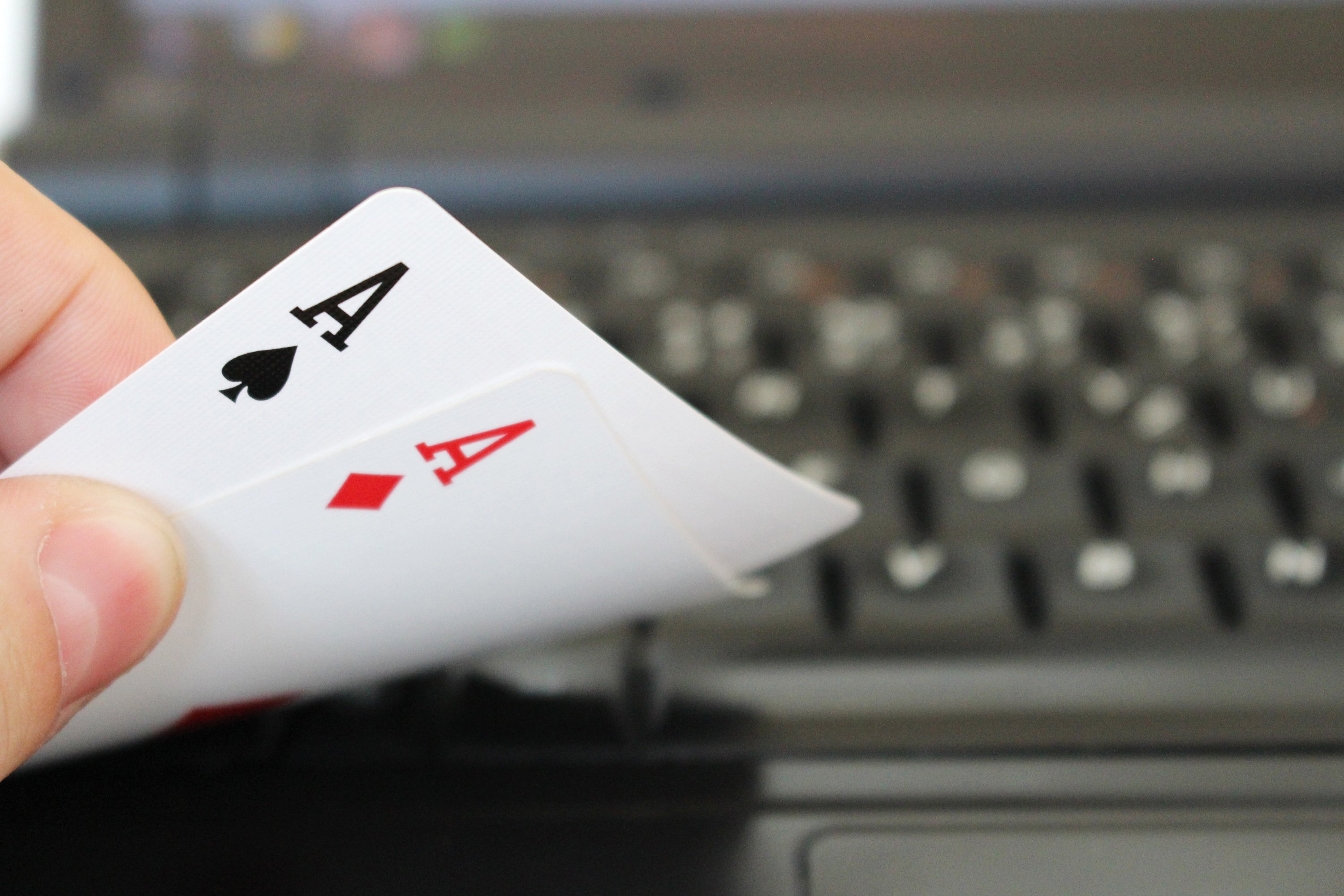 A pair of aces on a computer keyboard