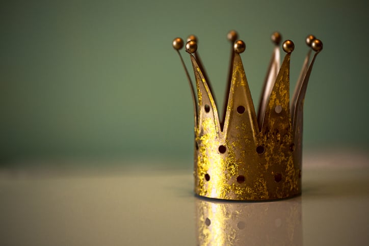 A tiny crown sitting on a table.
