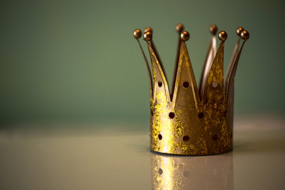 A tiny crown sitting on a table.