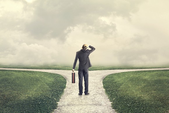 A man considering two possible paths forward