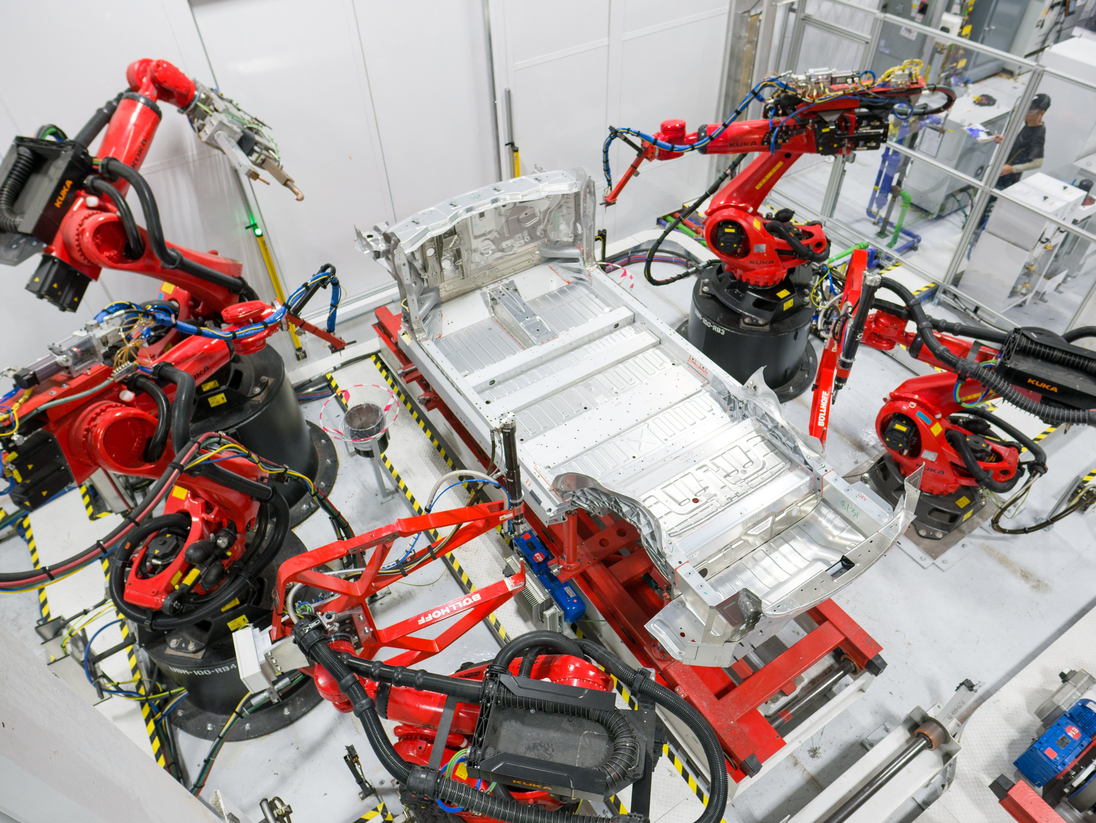 Assembly begins on a Tesla vehicle.