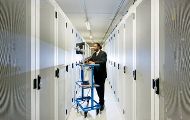 GETTY - Server Room and Worker Online on Computer
