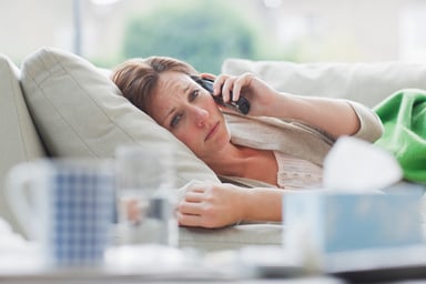 Sick woman on couch