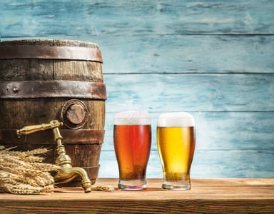 Beer Industry Craft Beer Sitting Next to Barrel