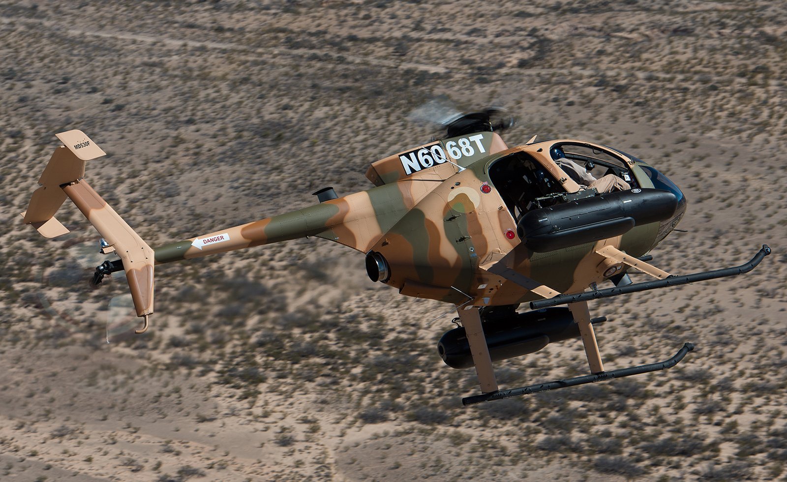 A camouflage painted MD 530.