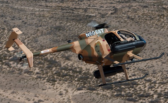 A camouflage painted MD 530.