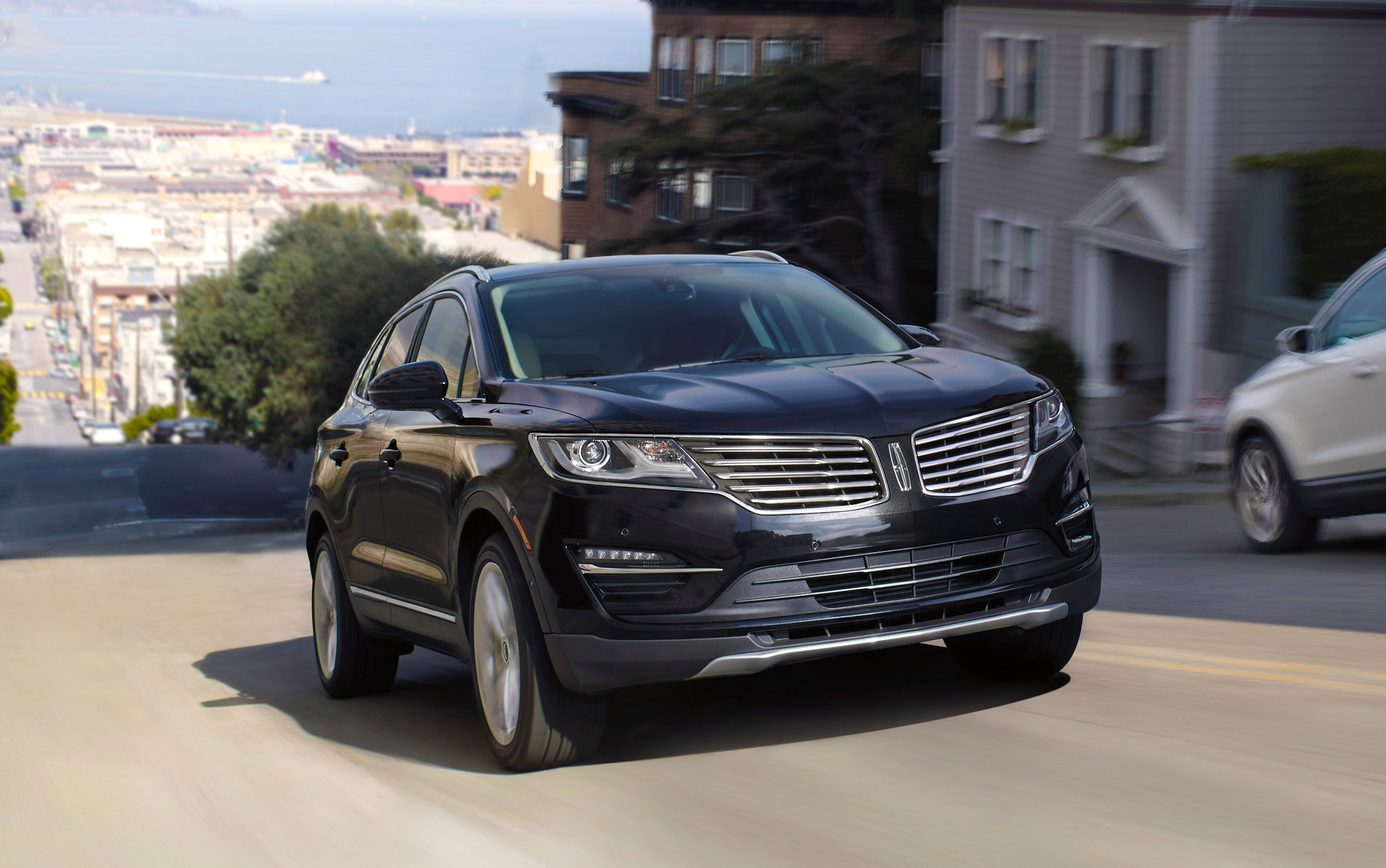 A black Lincoln MKC SUV on a street in San Francisco.