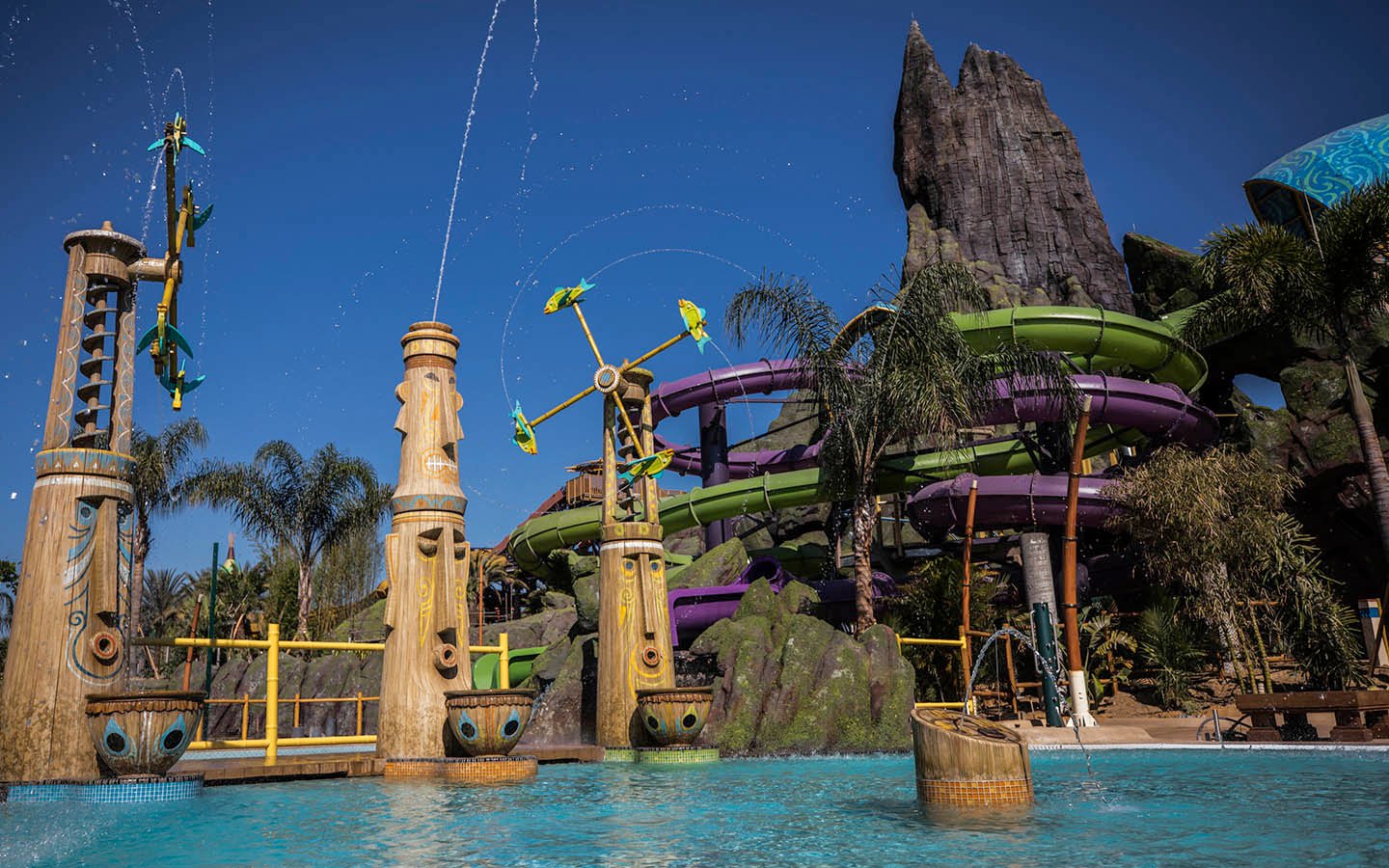 Volcano Bay tikis shooting water.