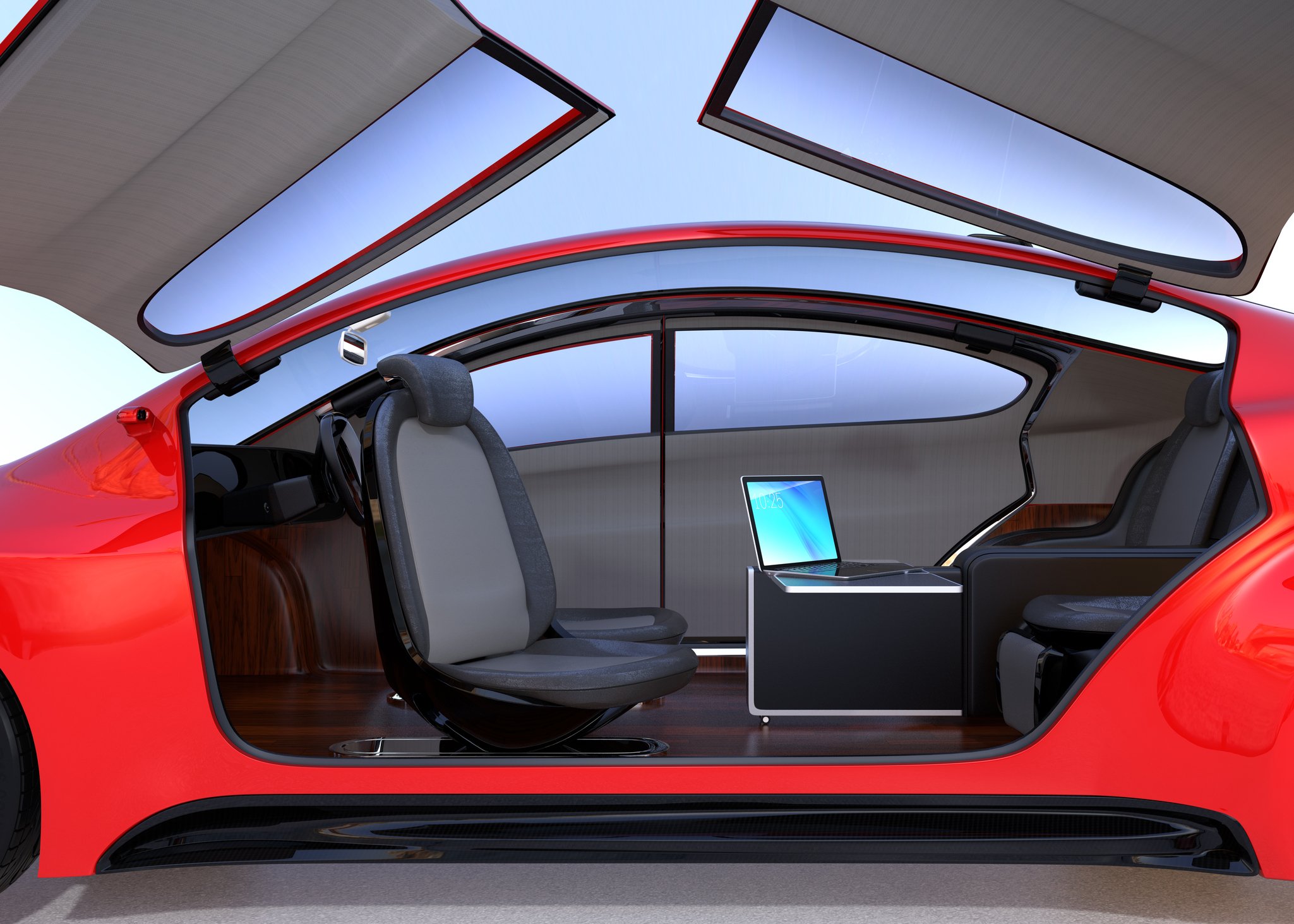 View of a driverless car with wing doors (doors hinged on the roof that open upward) open showing seats facing each other. There is no steering wheel.