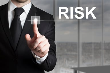 Risk - businessman pointing