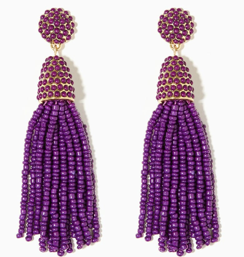 A pair of long purple earrings.