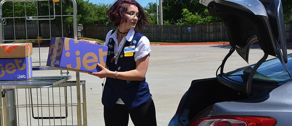 A Wal-Mart employee prepares to make a delivery. 