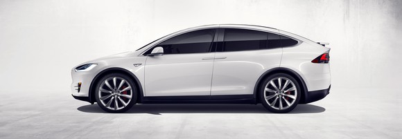 side view of white Tesla Model X