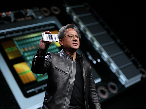 NVIDIA CEO Jensen Huang showing off the Volta GPU