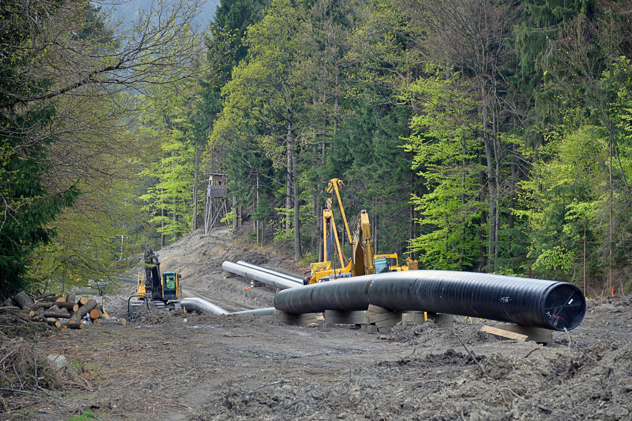 A pipeline under construction in the mountains. 