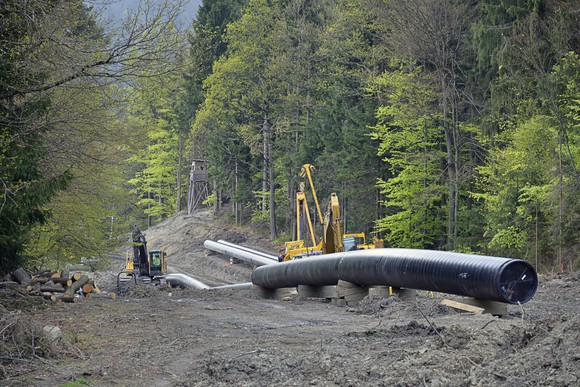 A pipeline under construction in the mountains. 