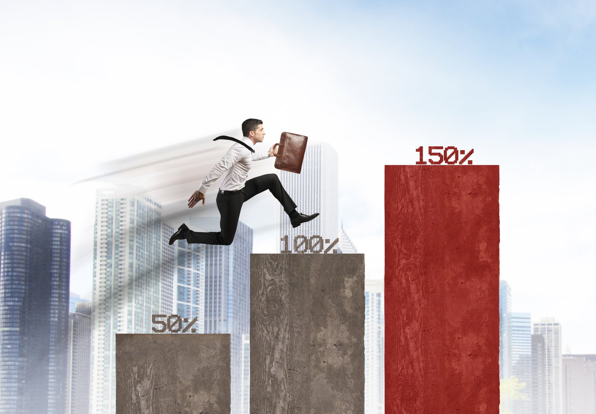 A man jumping up columns with different percentages on top