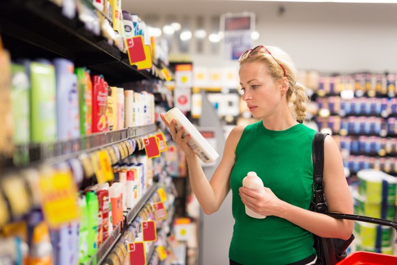 A consumer buying goods at a supermarket.