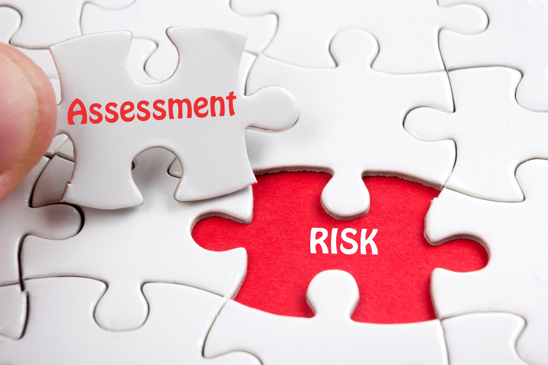 Concept for risk assessment -- a slot on puzzle board with for "risk" and a puzzle piece that fits it saying "assessment."