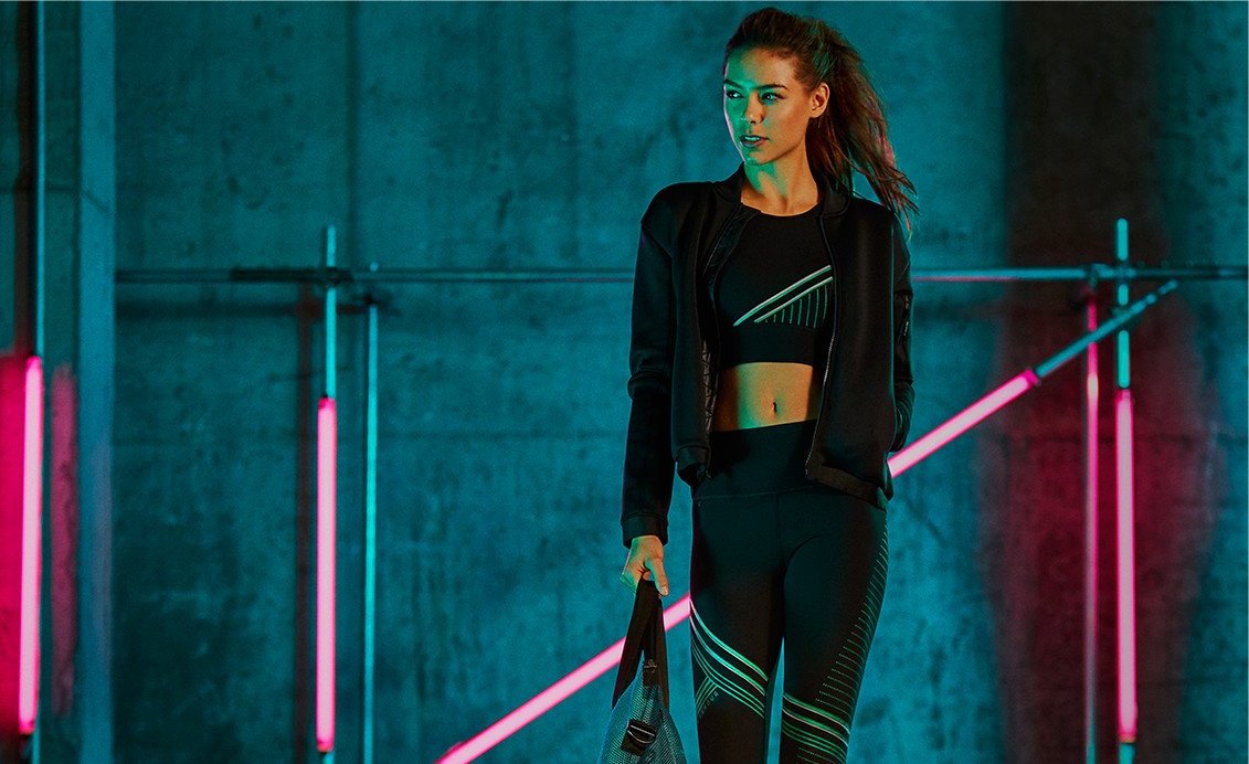 A young woman wearing UA apparel.