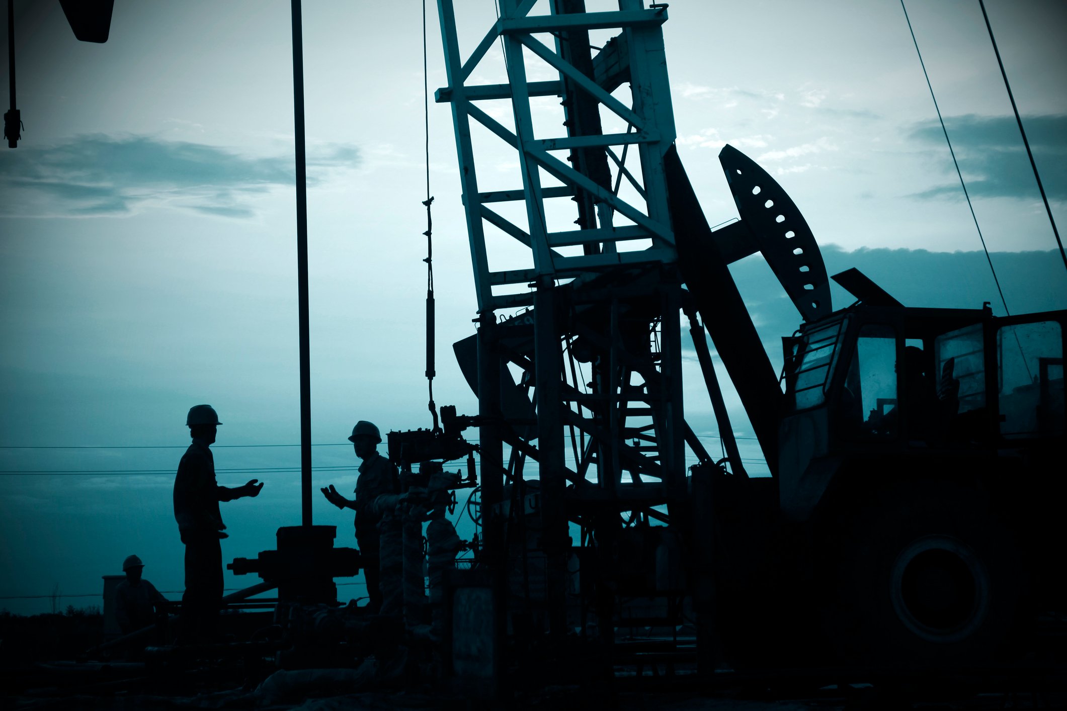 Drilling rig and pumpjack.