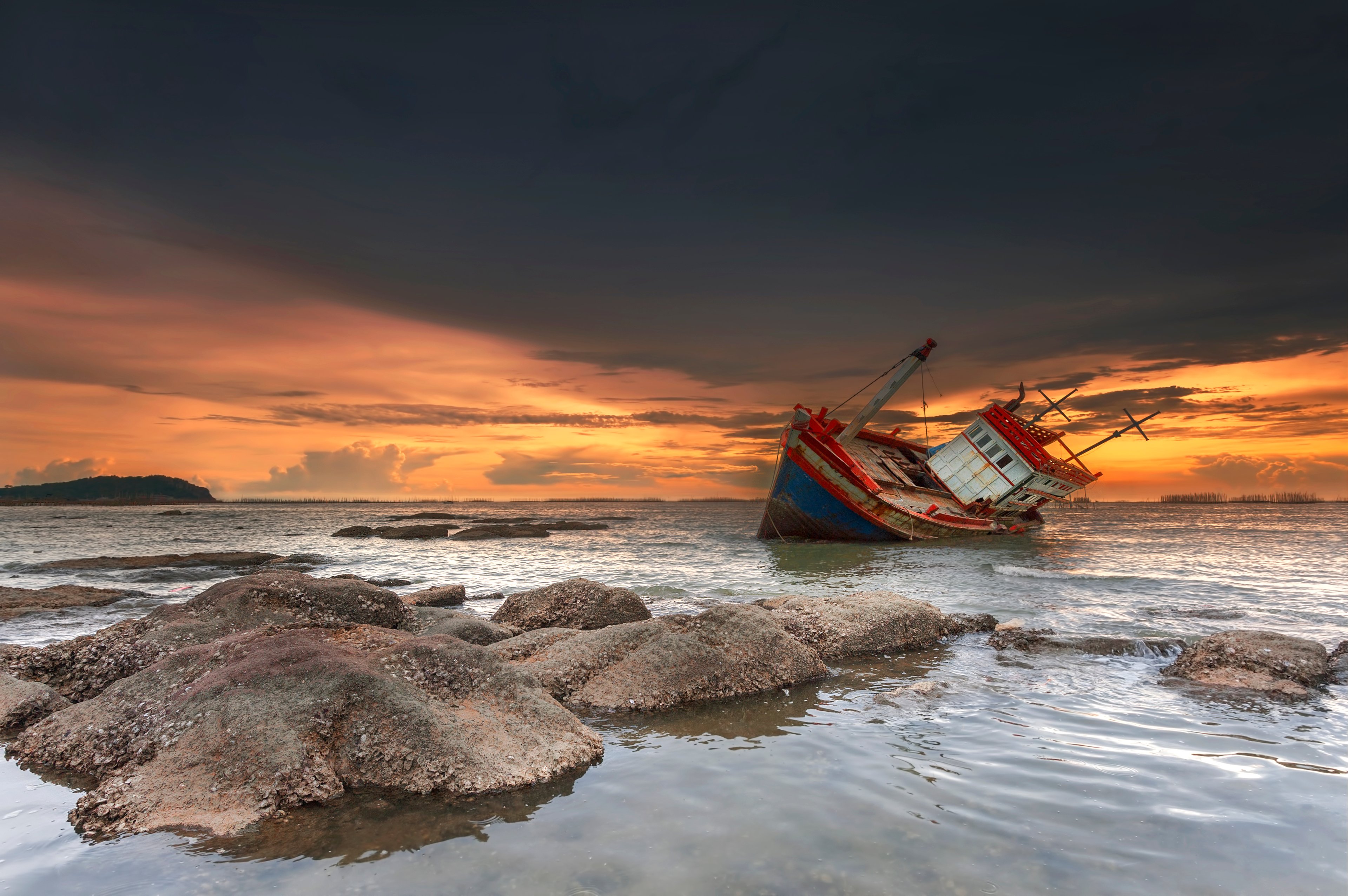 A shipwreck at sunset. 