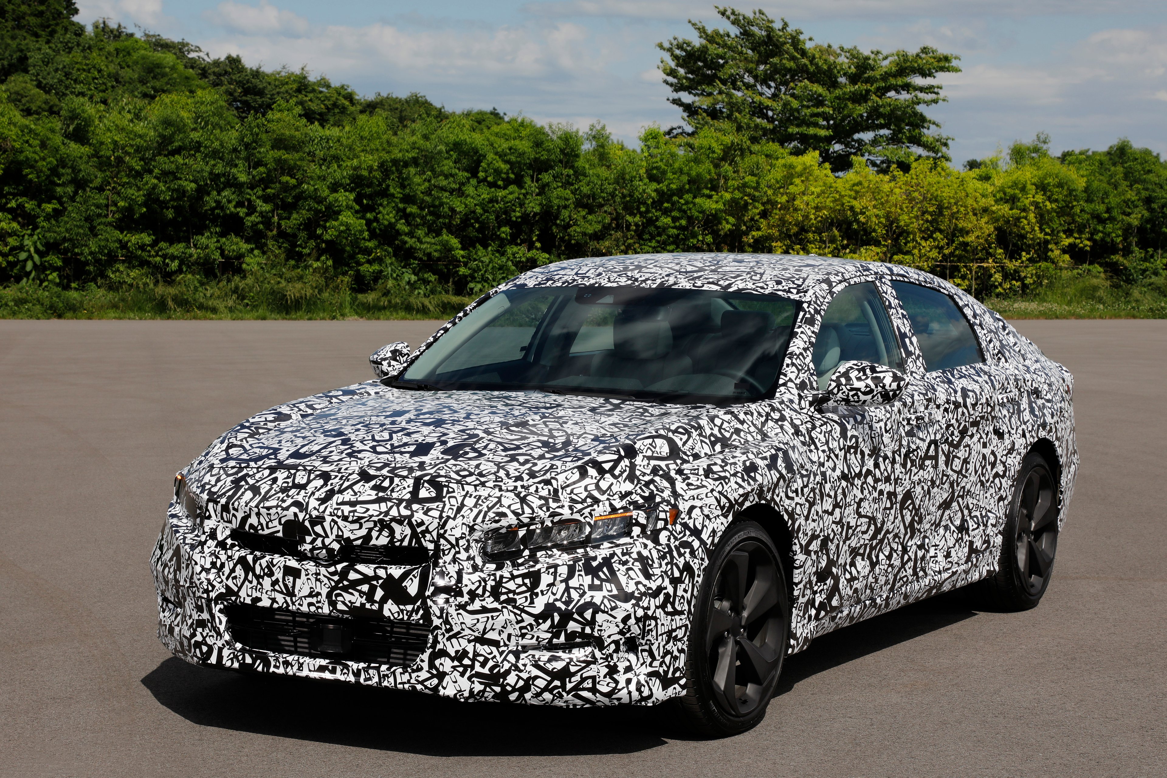 A 2018 Honda Accord covered in black-and-white camouflage to disguise details of its styling
