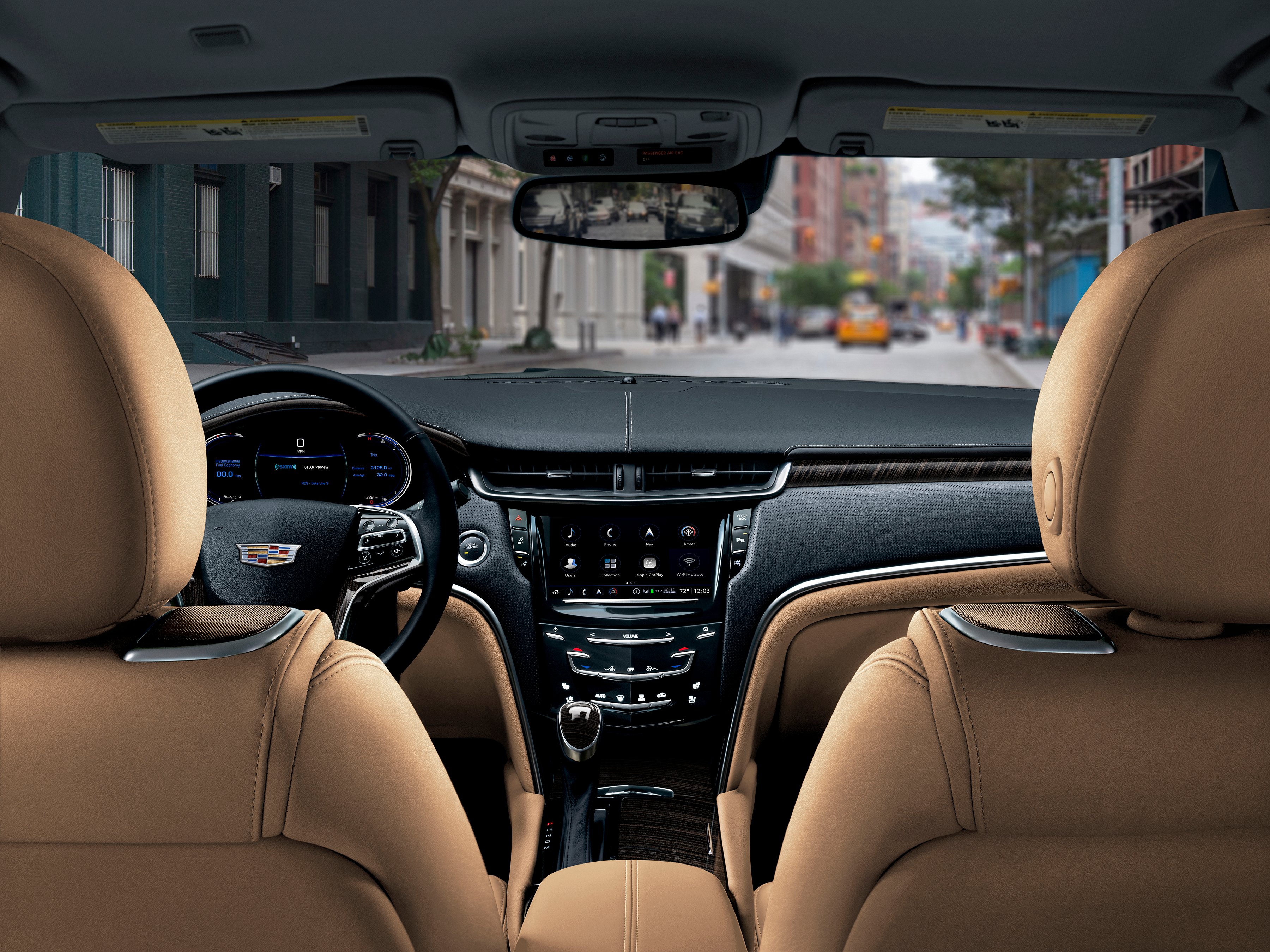 The 2018 Cadillac XTS's dash, viewed from the rear seat