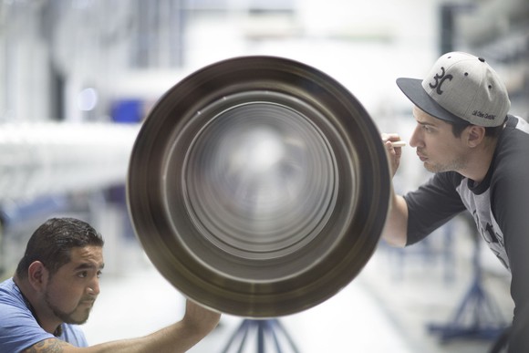 Technicians completing final work on Falcon 9 transfer tube.