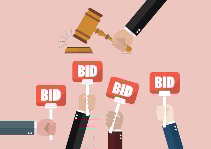 Vector illustration of hands holding up signs labeled "Bid" as a gavel comes down.