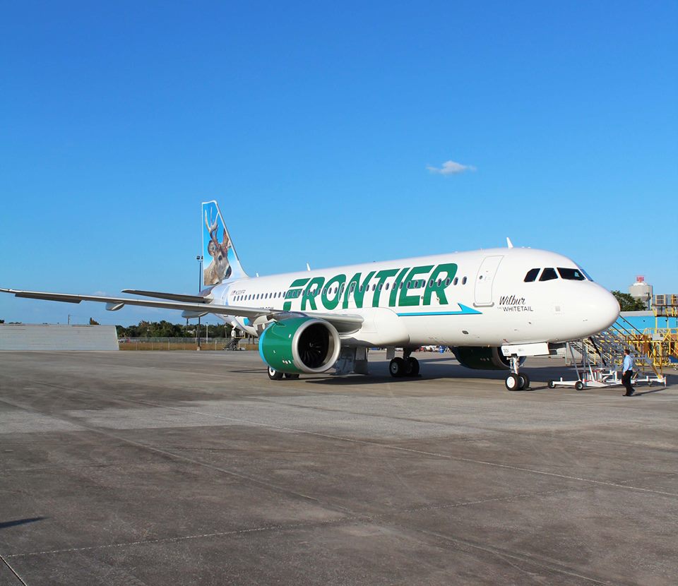 A Frontier airplane on the ground.