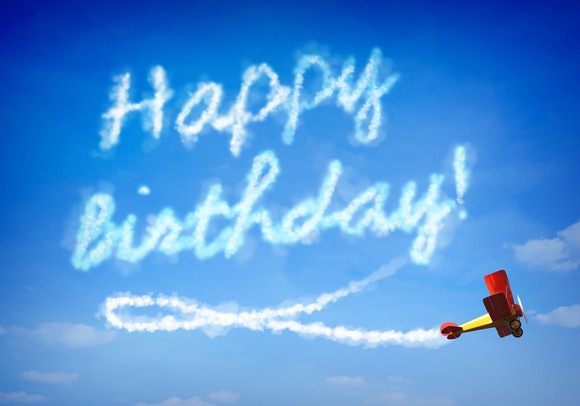 A prop plane skywriting "Happy Birthday!"